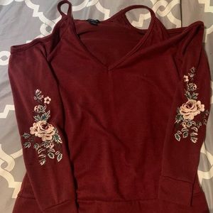 Maroon rue21 shoulder cutout sweater with flowers on the sleeves